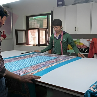 Fabric inspection at KK Fashion Exports manufacturing facility